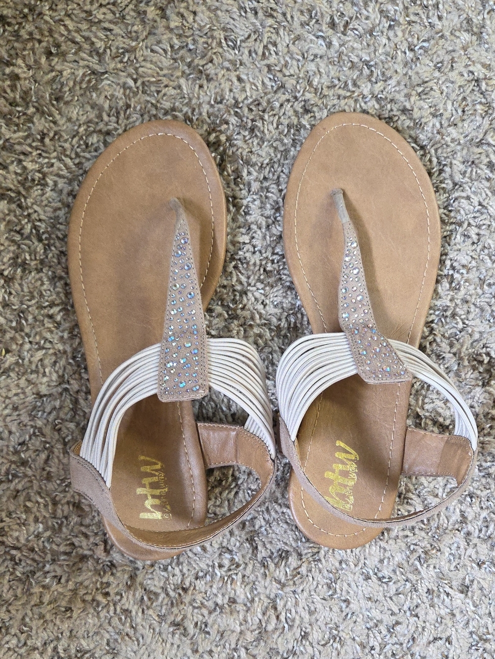 by the way. Tan and white jeweled toe-post sandals